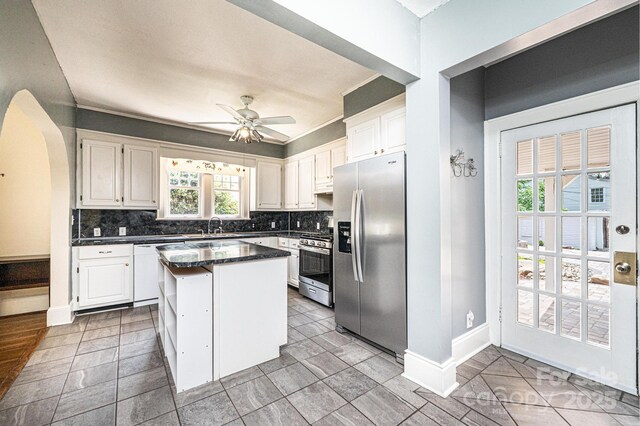 625 2nd St NE, Hickory, NC 28601 - kitchen featuring stainless steel appliances, healthy amount of natural light, and white cabinets