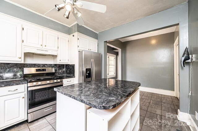 625 2nd St NE, Hickory, NC 28601 - kitchen featuring appliances with stainless steel finishes, under cabinet range hood, white cabinetry, a ceiling fan, and baseboards