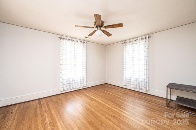 625 2nd St NE, Hickory, NC 28601 - unfurnished room featuring ceiling fan, baseboards, and wood finished floors