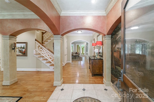 3400 Baucom Manor Rd, Monroe, NC 28110 - foyer with arched walkways, light tile patterned floors, decorative columns, ornamental molding, and stairs