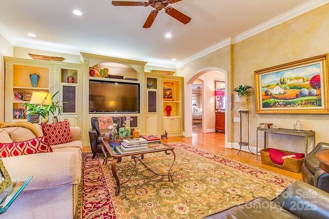 3400 Baucom Manor Rd, Monroe, NC 28110 - living room with crown molding, ceiling fan, arched walkways, recessed lighting, and wood finished floors