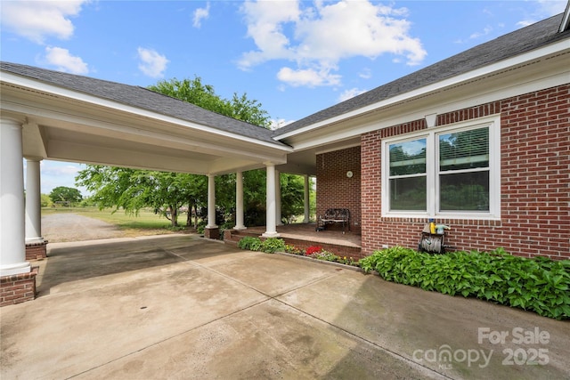 view of patio featuring driveway and covered porch