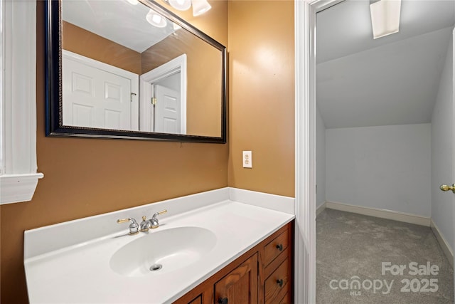 bathroom featuring vanity and baseboards