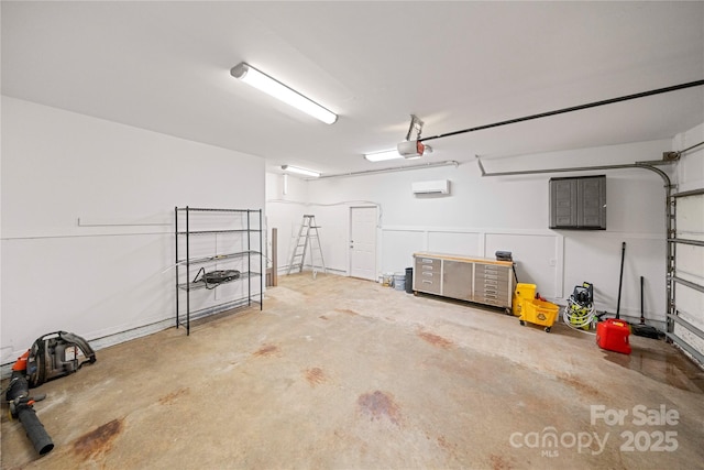 garage featuring a wall mounted air conditioner and a garage door opener