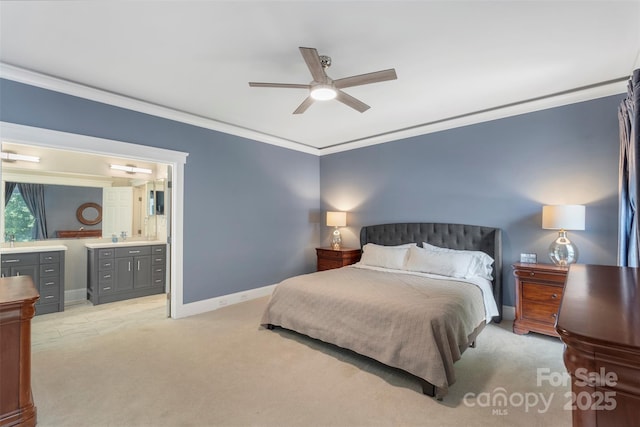 bedroom with ornamental molding, light carpet, a sink, connected bathroom, and baseboards