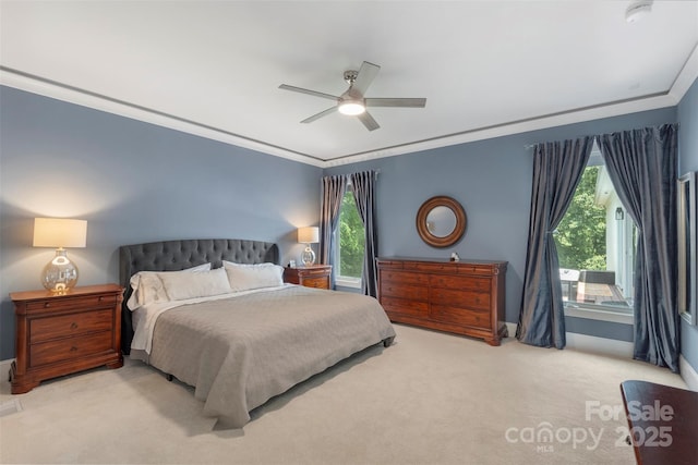bedroom with carpet flooring, multiple windows, baseboards, and ornamental molding