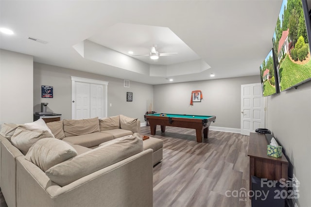 playroom featuring a raised ceiling, billiards table, recessed lighting, baseboards, and wood finished floors