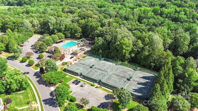 1004 Berwick Ct, Waxhaw, NC 28173 - aerial view of property and surrounding area with a pool area and a heavily wooded area
