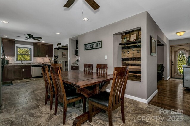 dining area with stone tile floors, recessed lighting, ceiling fan, and baseboards