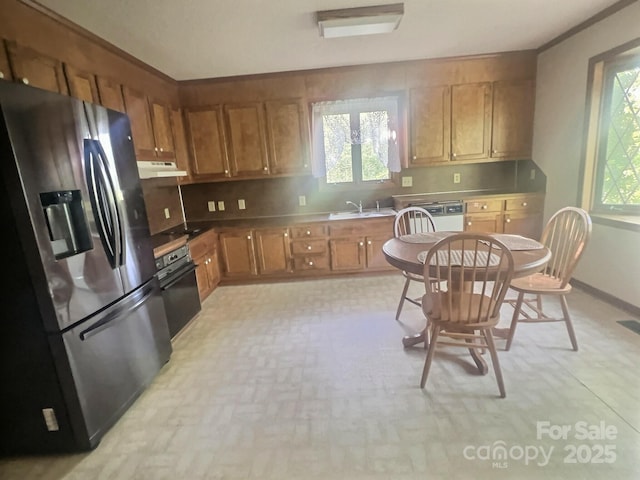 352 Edgemont Dr, Kings Mountain, NC 28086 - kitchen with brown cabinets, stainless steel fridge with ice dispenser, under cabinet range hood, and a sink