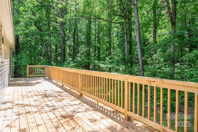 deck featuring a forest view