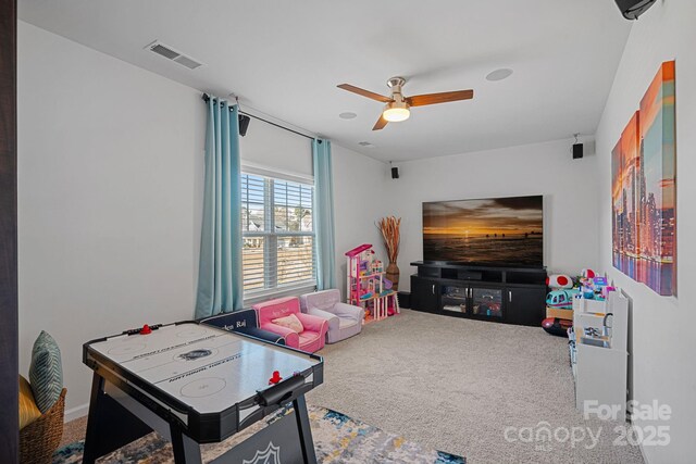 playroom with carpet flooring and ceiling fan