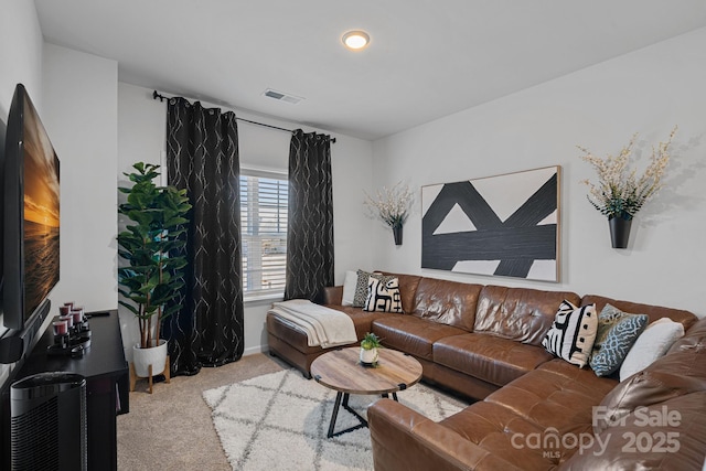 living room with carpet and baseboards