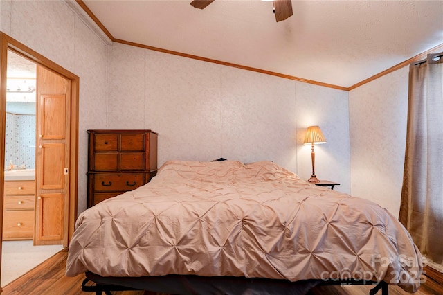 bedroom featuring crown molding, a ceiling fan, and wood finished floors