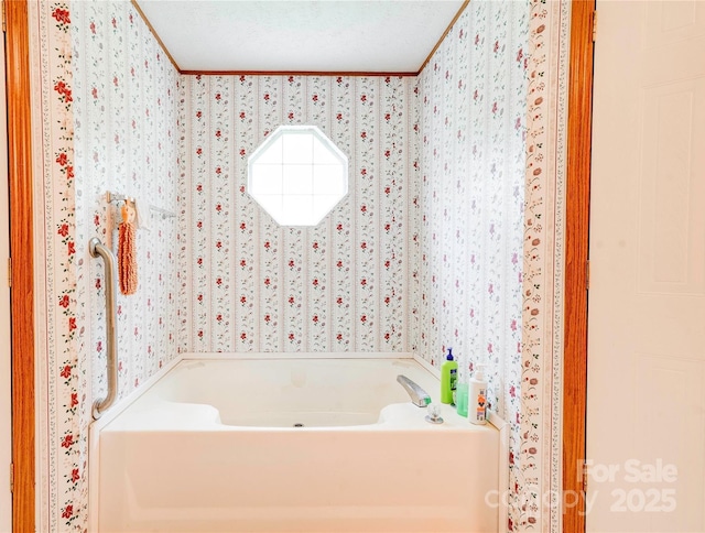 full bath with wallpapered walls and a garden tub