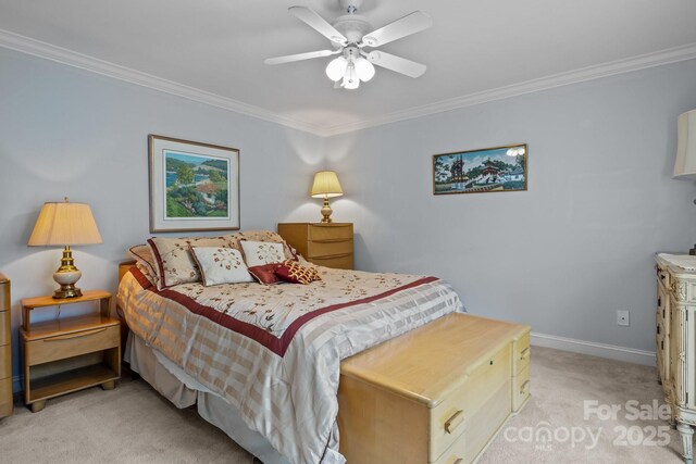 bedroom featuring crown molding, baseboards, ceiling fan, and light colored carpet