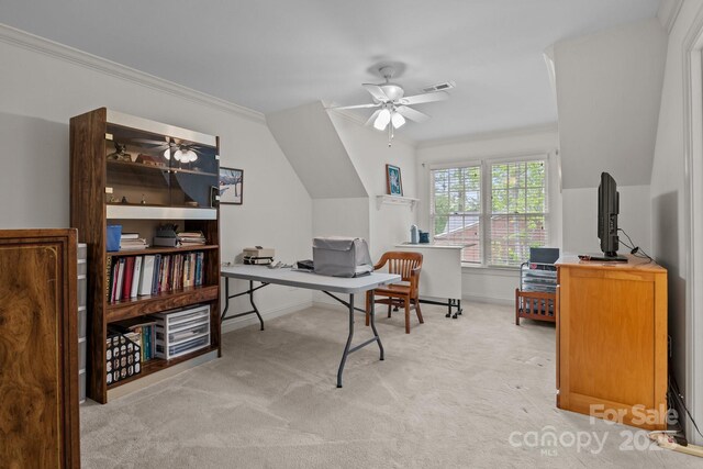 carpeted office featuring crown molding, ceiling fan, visible vents, and baseboards