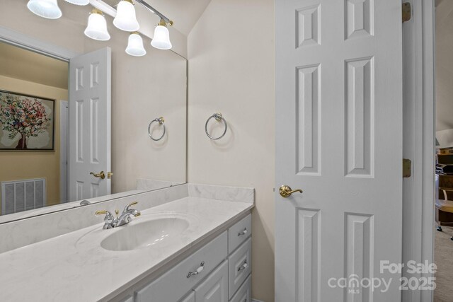 bathroom featuring visible vents and vanity