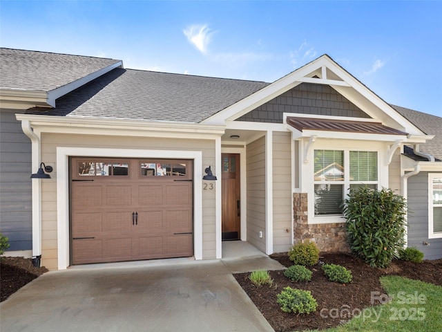 23 Heartleaf Cir, Arden, NC 28704 - view of front of property with concrete driveway, roof with shingles, an attached garage, and stone siding
