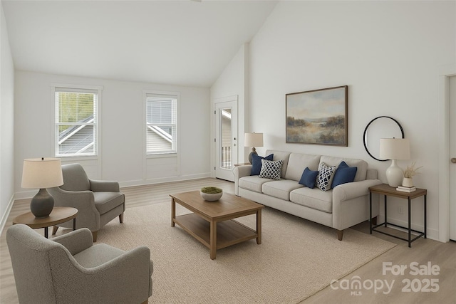 23 Heartleaf Cir, Arden, NC 28704 - living area featuring light wood-style floors, lofted ceiling, and baseboards