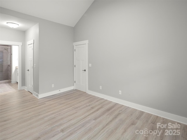23 Heartleaf Cir, Arden, NC 28704 - unfurnished room featuring baseboards, light wood-type flooring, and high vaulted ceiling