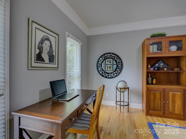 office featuring baseboards, light wood-style floors, and ornamental molding