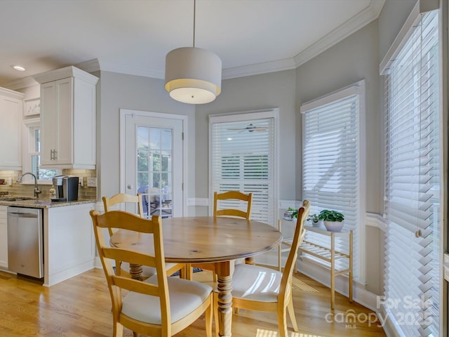 dining area featuring recessed lighting, light wood finished floors, and ornamental molding
