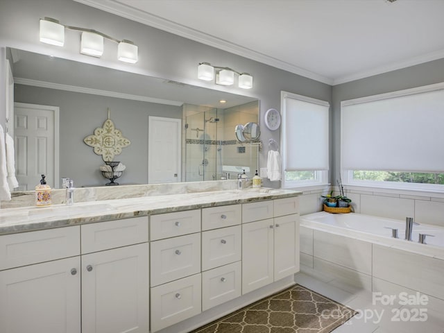 bathroom featuring double vanity, ornamental molding, a sink, a bath, and a stall shower