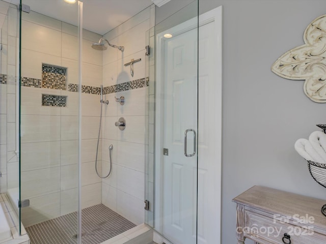 full bath with a shower stall