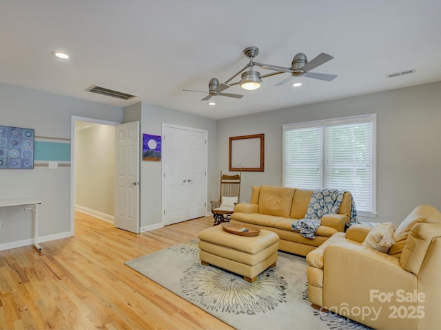 living room featuring recessed lighting, light wood-type flooring, visible vents, and a ceiling fan