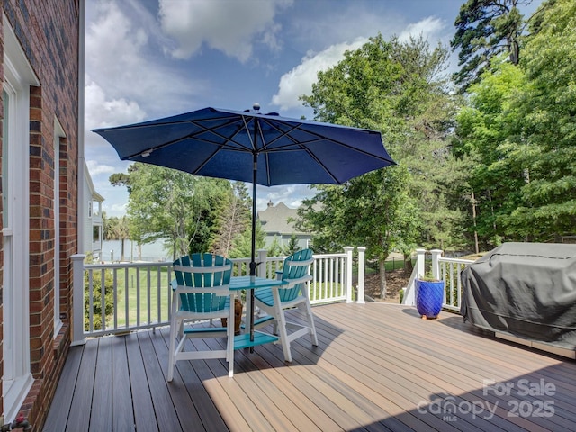 wooden terrace featuring grilling area