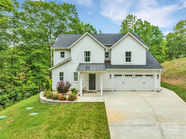 modern farmhouse style home with roof with shingles, board and batten siding, concrete driveway, and a front lawn