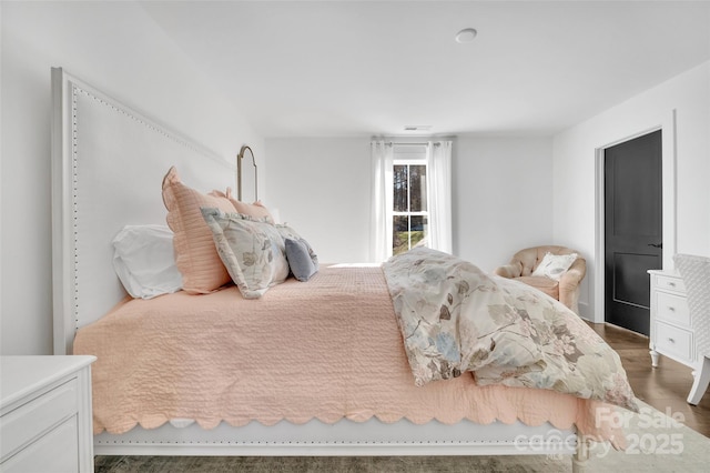 bedroom with wood finished floors