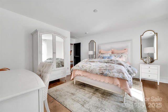 bedroom with wood finished floors