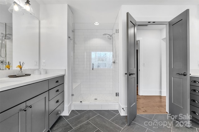 full bathroom with vanity, tile patterned flooring, a shower stall, and recessed lighting