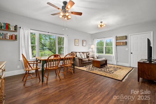dining space with wood finished floors, ceiling fan, and a healthy amount of sunlight