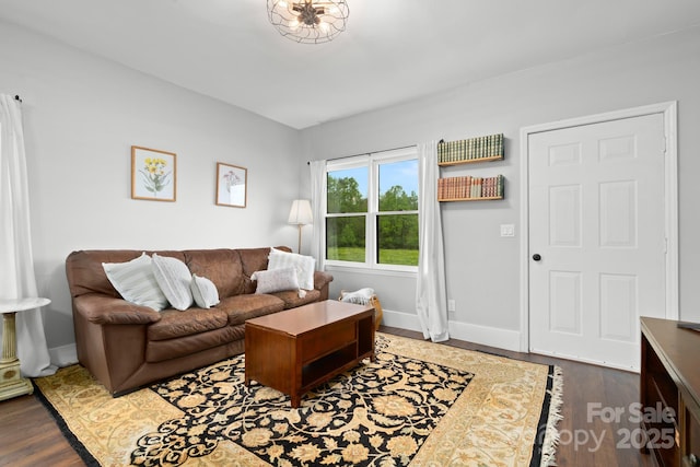 living room featuring baseboards and wood finished floors