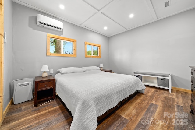bedroom with recessed lighting, visible vents, a wall mounted AC, and wood finished floors