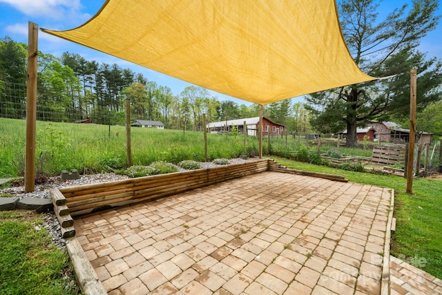 view of patio / terrace featuring fence