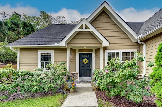 view of front of property with a shingled roof