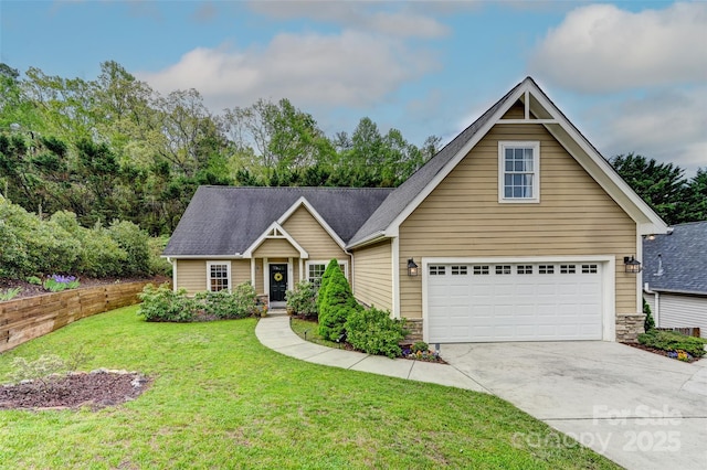view of front facade with a garage, a front lawn, roof with shingles, and driveway