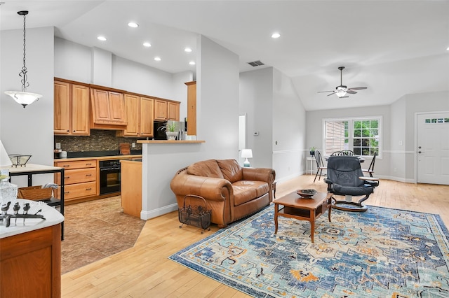 living area with light wood-style floors, ceiling fan, recessed lighting, and visible vents