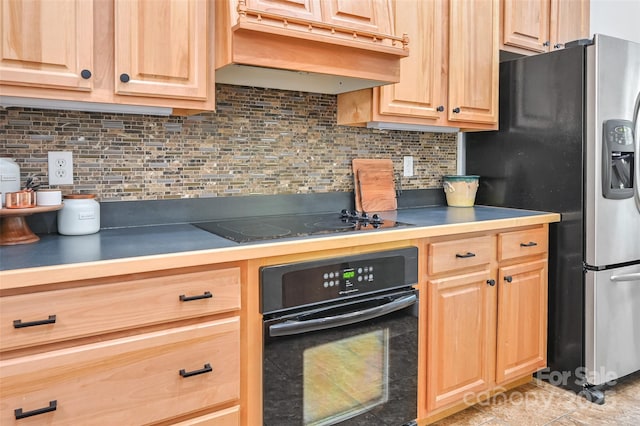 kitchen with light brown cabinetry, black appliances, and custom range hood