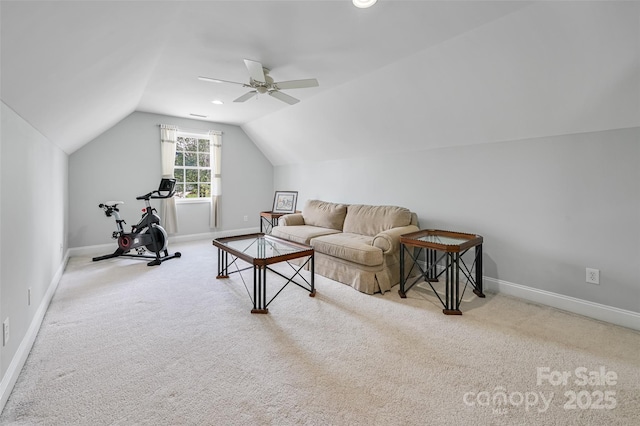 carpeted living area with baseboards, ceiling fan, and lofted ceiling