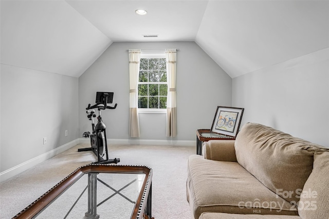 workout area featuring baseboards, visible vents, carpet, and vaulted ceiling