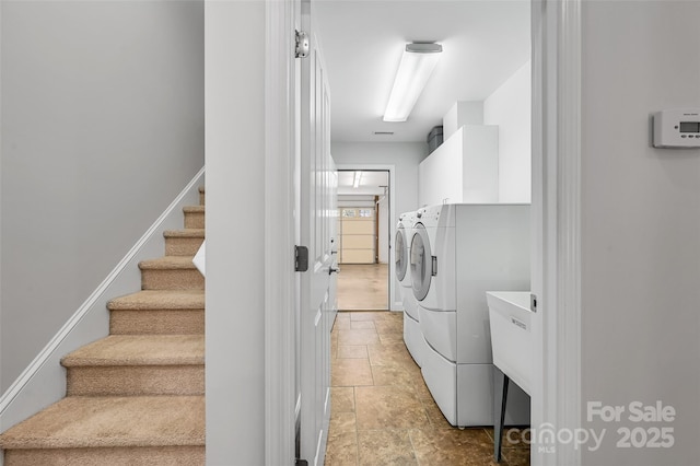 laundry area with cabinet space and washing machine and dryer