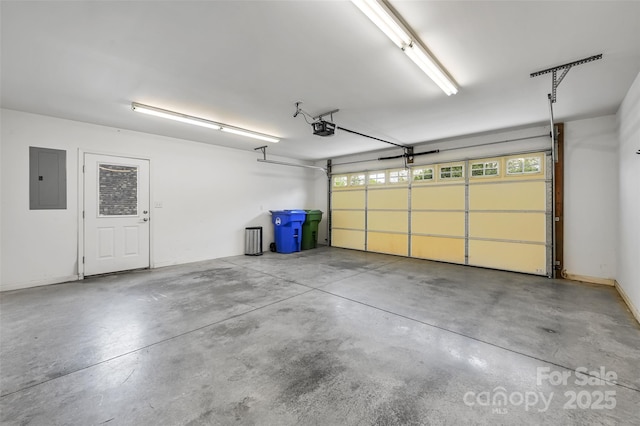 garage featuring a garage door opener and electric panel