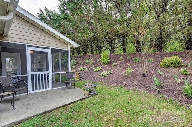 view of yard with a patio and a sunroom