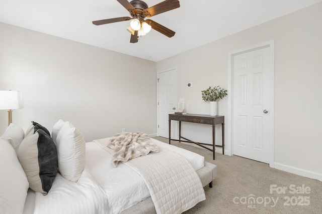 bedroom with baseboards, light carpet, and ceiling fan