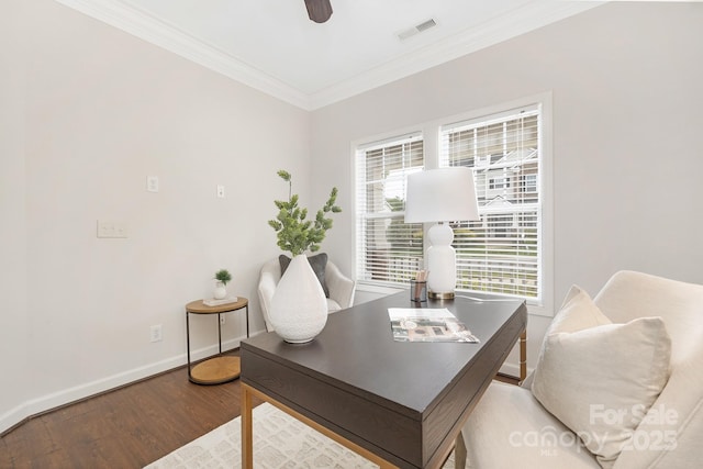 home office with a ceiling fan, visible vents, baseboards, ornamental molding, and wood finished floors